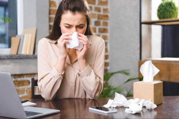 Woman Blowing Nose 