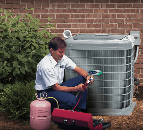 technician working on an HVAC unit