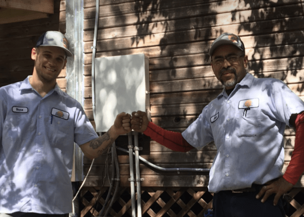 Two team members fist bumping 