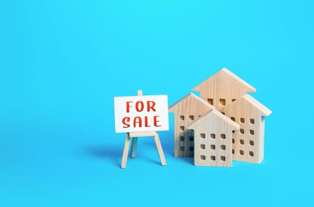 Wooden Toy Houses with For Sale Sign 